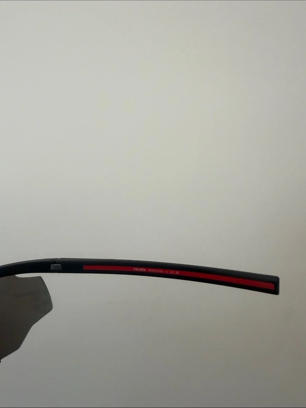 Prada Sports Sunglasses with Red Mirrored Lenses